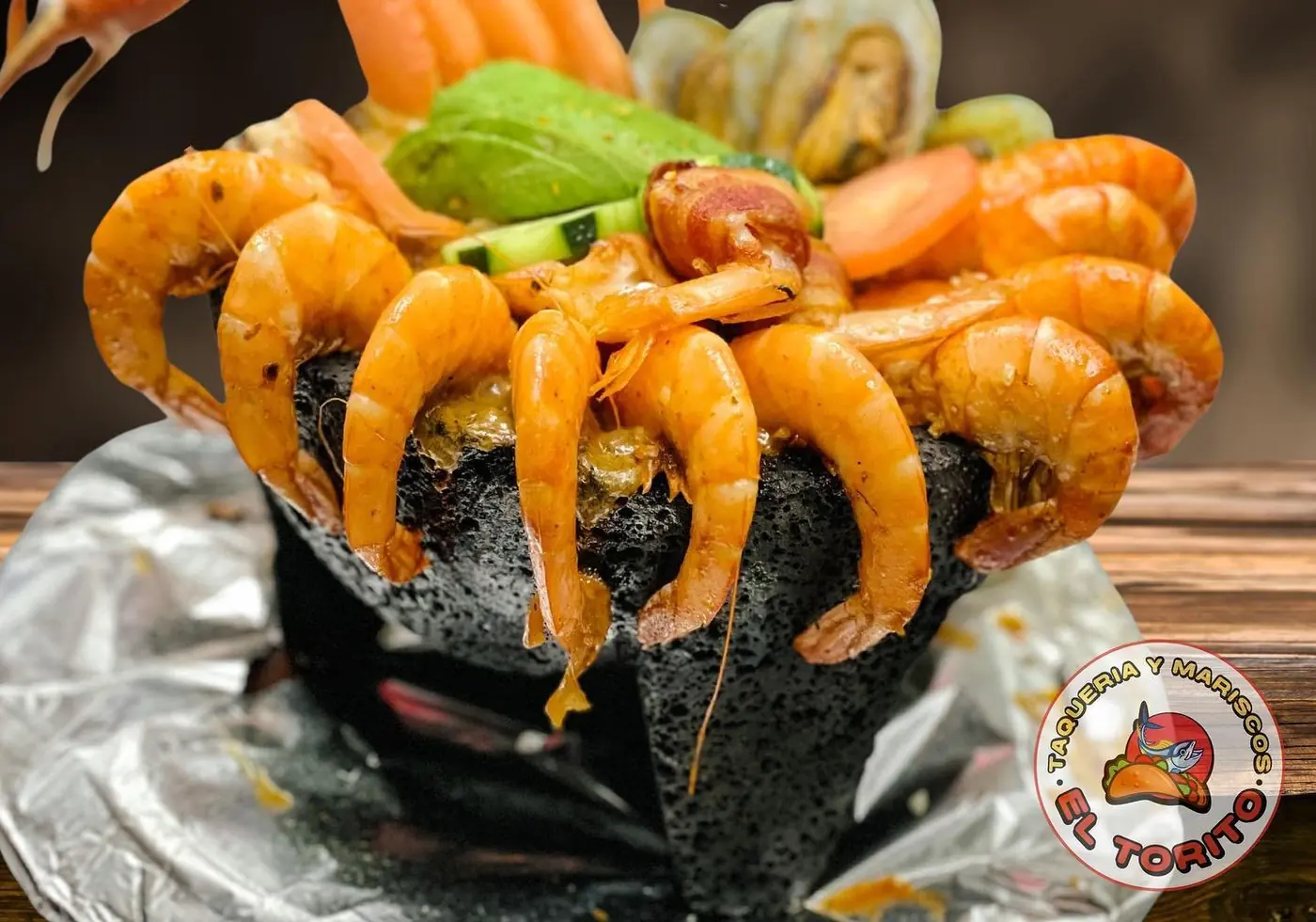 Molcajete del Mar crowned with shrimp